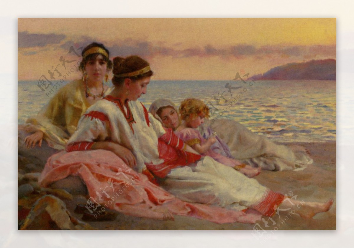 海滩休息的女人和孩子图片