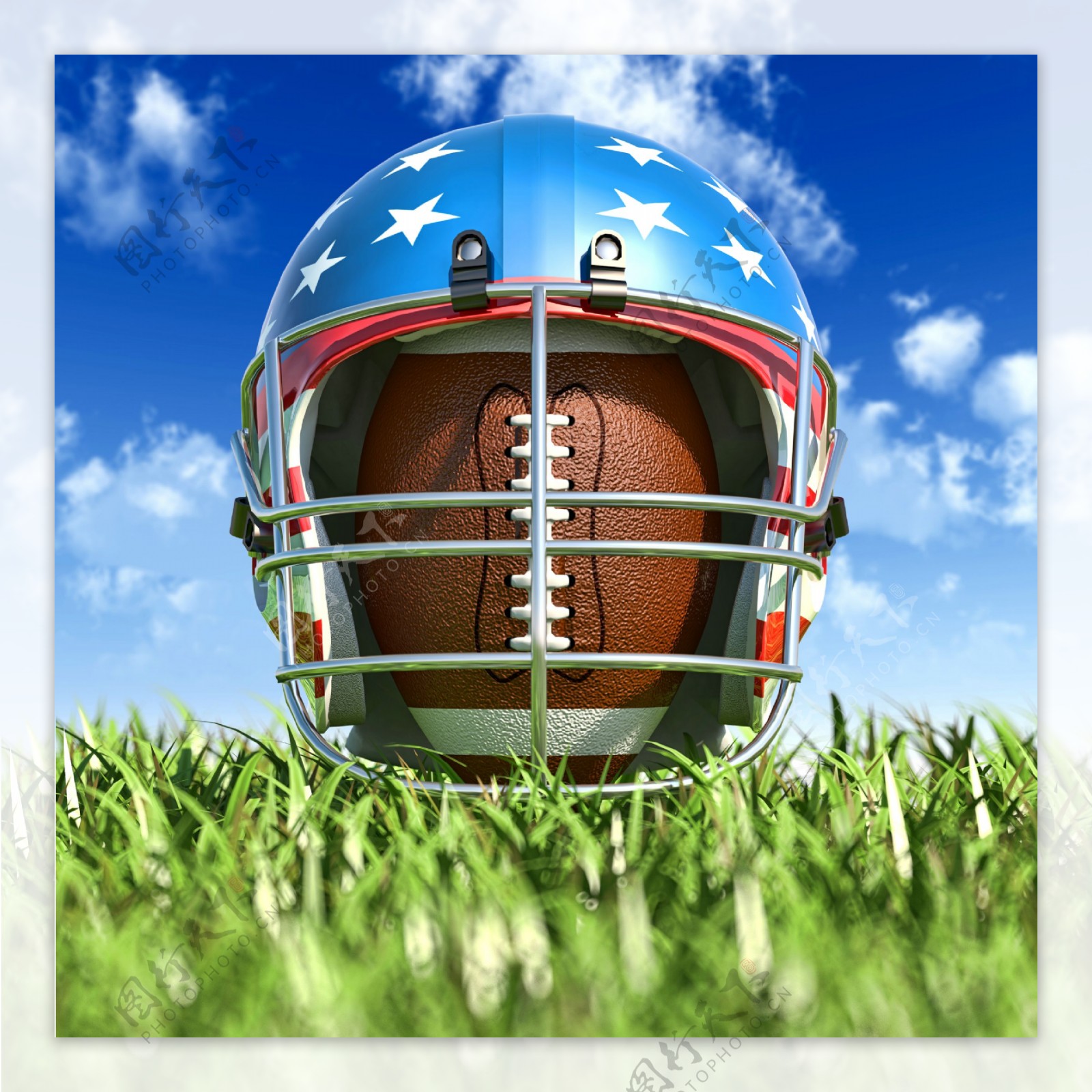 草地上的头盔与橄榄球图片